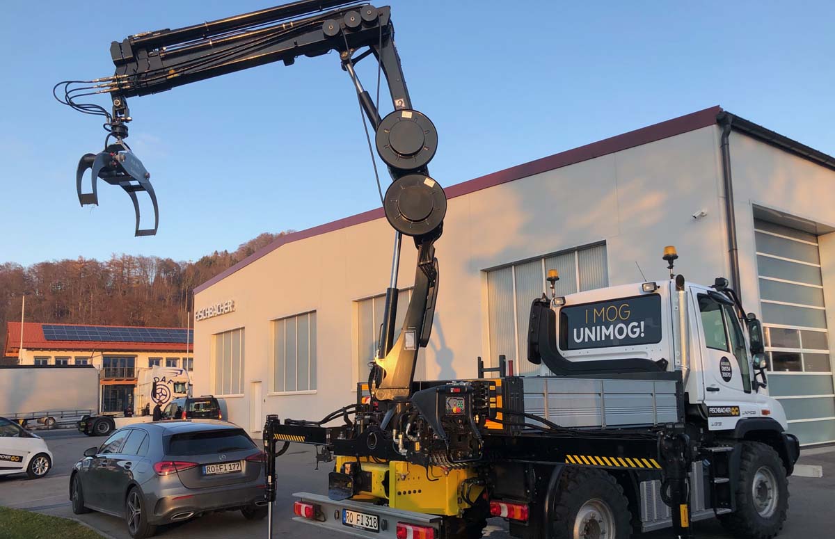 Kran-Unimog System wechselbarer Heckanbaukran am Unimog